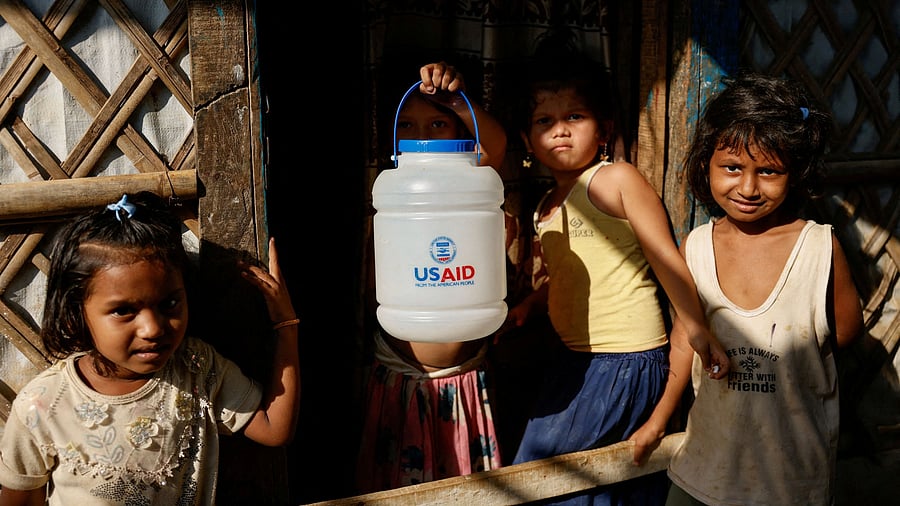 <div class="paragraphs"><p>A Rohingya refugee girl holds a jar.</p></div>