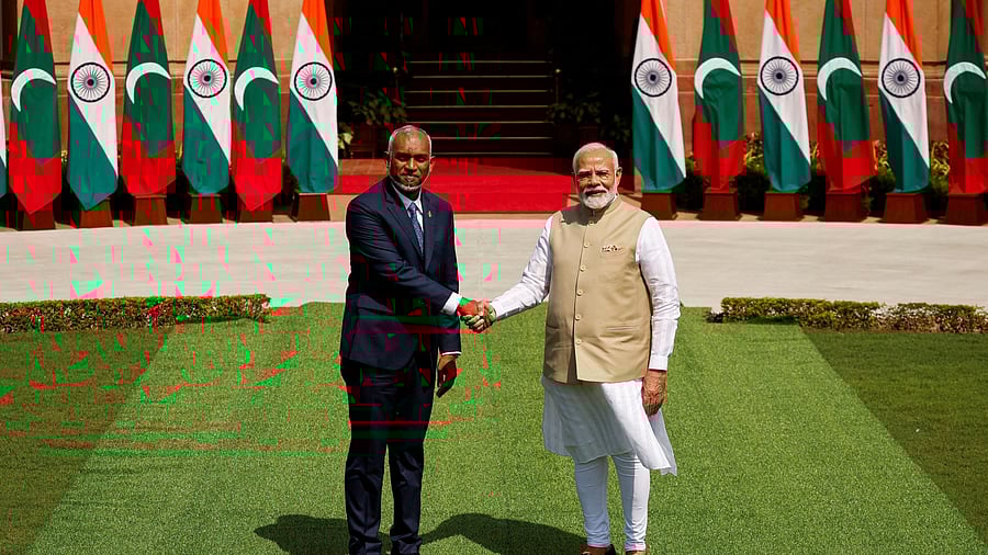 <div class="paragraphs"><p>Maldives' President Mohamed Muizzu shakes hands with Indian Prime Minister Narendra Modi </p></div>