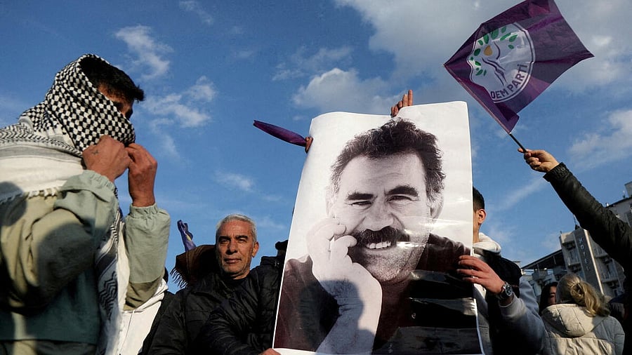<div class="paragraphs"><p> A demonstrator holds a picture of jailed Kurdish militant leader Ocalan.</p></div>