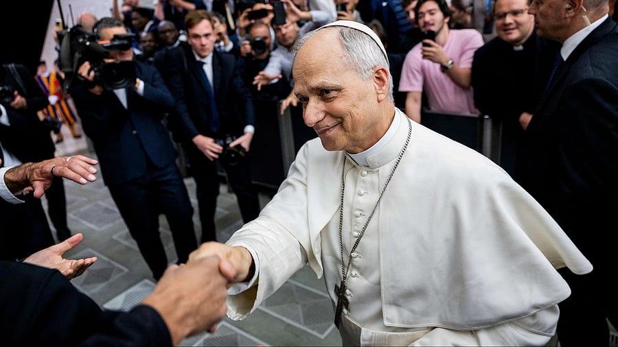 <div class="paragraphs"><p> Pope Leo XIV shakes hand during an audience with representatives of the media.</p></div>