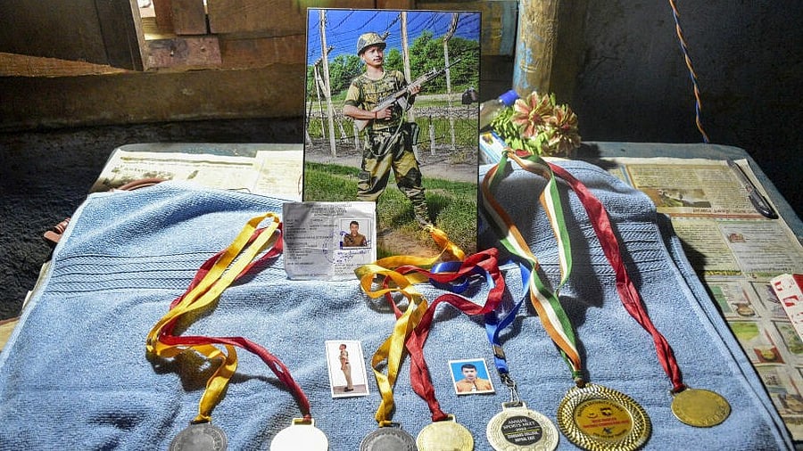 <div class="paragraphs"><p> A photograph and medals won by BSF jawan Deepak Chingakham, who lost his life in the line of duty in J &amp; K, at his residence in Yairipok Yambem, Monday, May 12, 2025. Deepak's mortal remains will be flown to Imphal on Tuesday, May 13.</p></div>