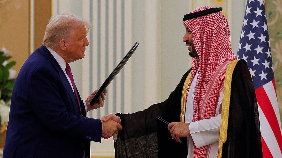 <div class="paragraphs"><p>US President Donald Trump and Saudi Crown Prince and Prime Minister Mohammed Bin Salman shake hands during a Memorandum of Understanding  signing ceremony at the Royal Court in Riyadh, Saudi Arabia, May 13, 2025. </p></div>