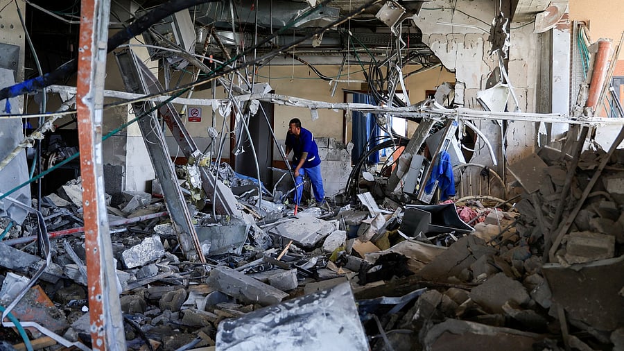 <div class="paragraphs"><p>A person inspects Nasser Hospital a part of which was damaged in the aftermath of an Israeli strike, according to Gaza Health Ministry, in Khan Younis, in the southern Gaza Strip, May 13, 2025.</p></div>