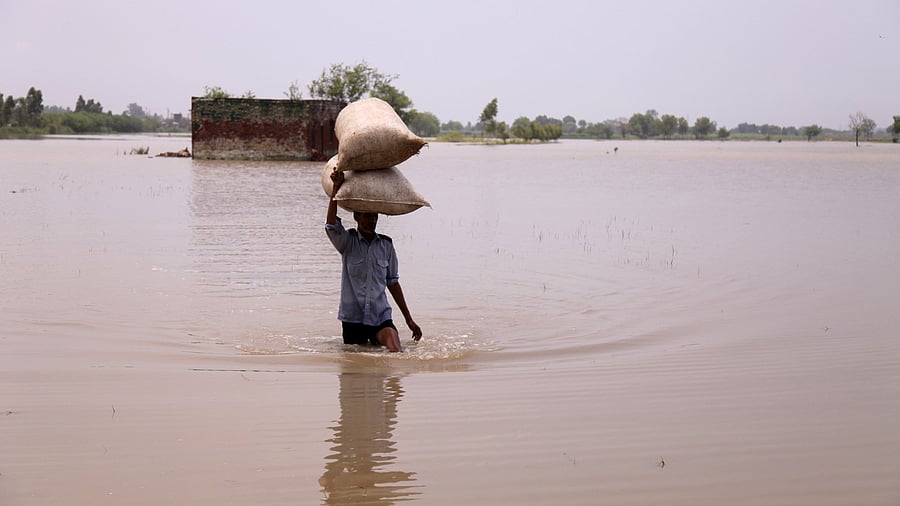 <div class="paragraphs"><p>Representative image showing a flooded village</p></div>
