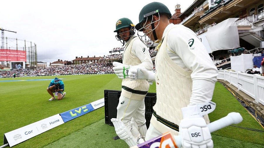 <div class="paragraphs"><p>File Photo: Australia's David Warner and Usman Khawaja take to the field for start of the day's play. </p></div>