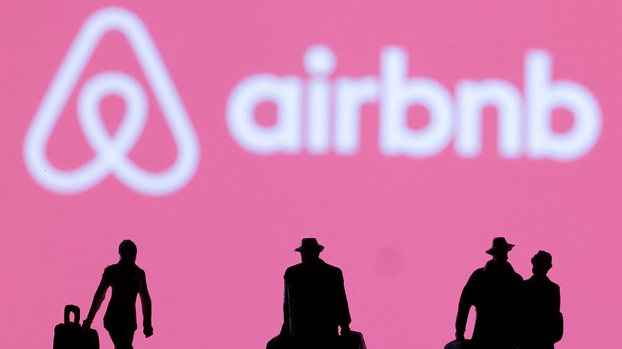 FILE PHOTO: Figurines are seen in front of the Airbnb logo in this illustration taken February 27, 2022. REUTERS/Dado Ruvic/Illustration/File Photo