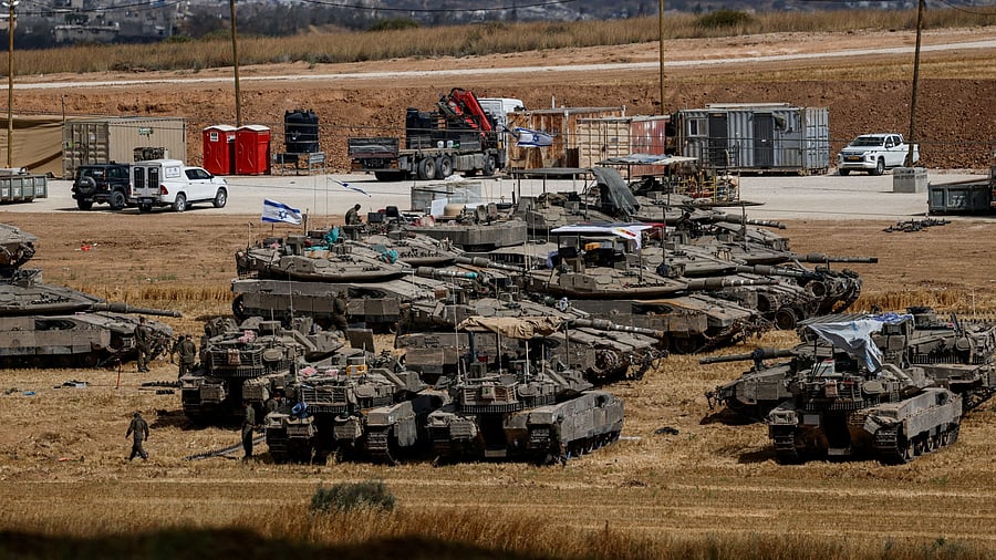 <div class="paragraphs"><p>Israeli tanks are seen, near the Israel-Gaza border, in Israel</p></div>
