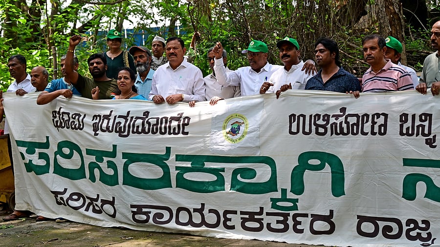 <div class="paragraphs"><p>Activists protest at the colony premises on Thursday. </p></div>