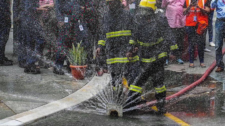 <div class="paragraphs"><p>Firefighters during a fire mock drill organised by the Karnataka State Fire and Emergency Services Department.</p></div>