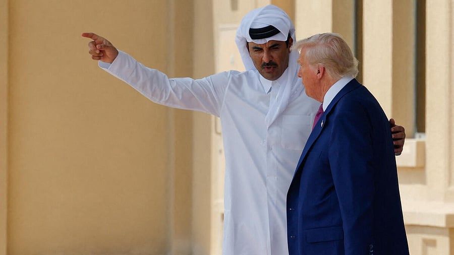 <div class="paragraphs"><p>US President Donald Trump talks with Qatar's Emir Tamim bin Hamad Al Thani, before being seen off to Air Force One at Al Udeid Air Base, en-route to Abu Dhabi, United Arab Emirates, in Doha, Qatar, May 15, 2025.</p></div>