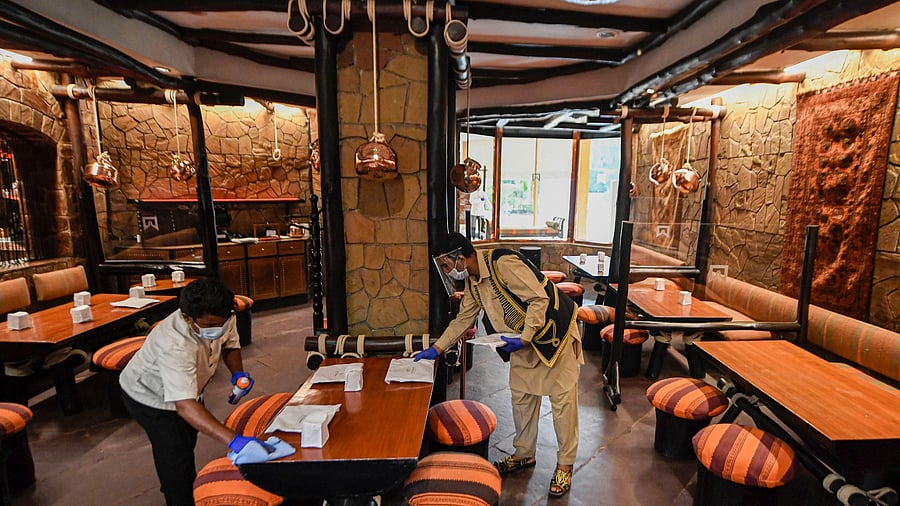 <div class="paragraphs"><p>Hotel staff carry out sanitation work at Bukhara restaurant of ITC Maurya Hotel, in New Delhi, Friday.</p></div>