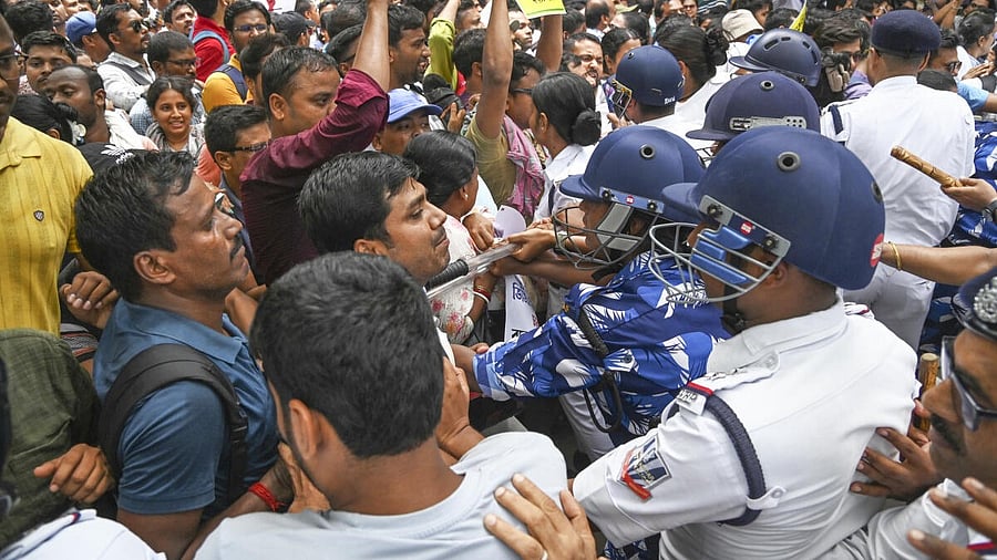 <div class="paragraphs"><p>School teachers, who have been rendered jobless by a Supreme Court order, being stopped by police personnel during their protest demanding restoration of their jobs, in front of the office of the state education minister in Kolkata, Thursday, May 15, 2025.</p></div>