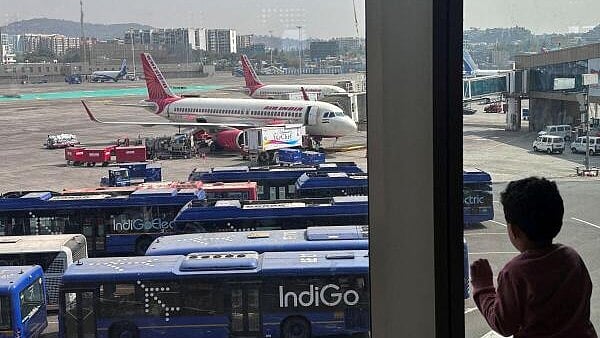<div class="paragraphs"><p>A boy looks at passenger aircrafts</p></div>