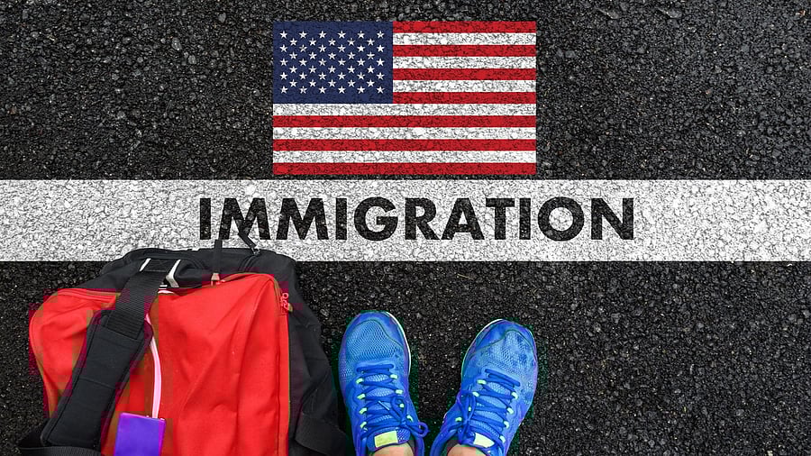 <div class="paragraphs"><p>Man in shoes with bag standing next to line with word IMMIGRATION and flag of the United States</p></div>