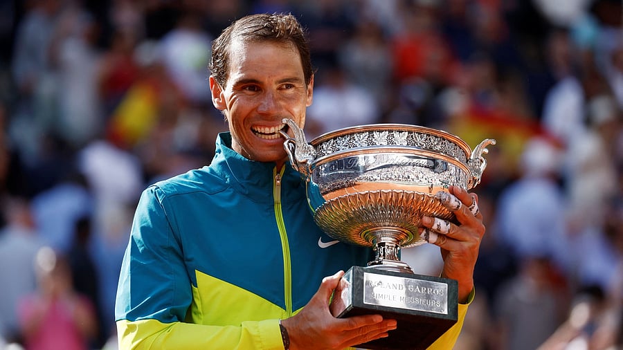 Spain's Rafael Nadal with the last of his 14 French Open trophies that he won in 2022, beating Norway's Casper Ruud in the final. REUTERS