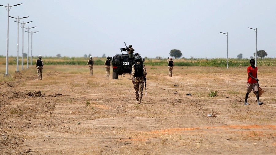 <div class="paragraphs"><p>Nigerian Security Forces patrol outside Ngarannam.</p></div>