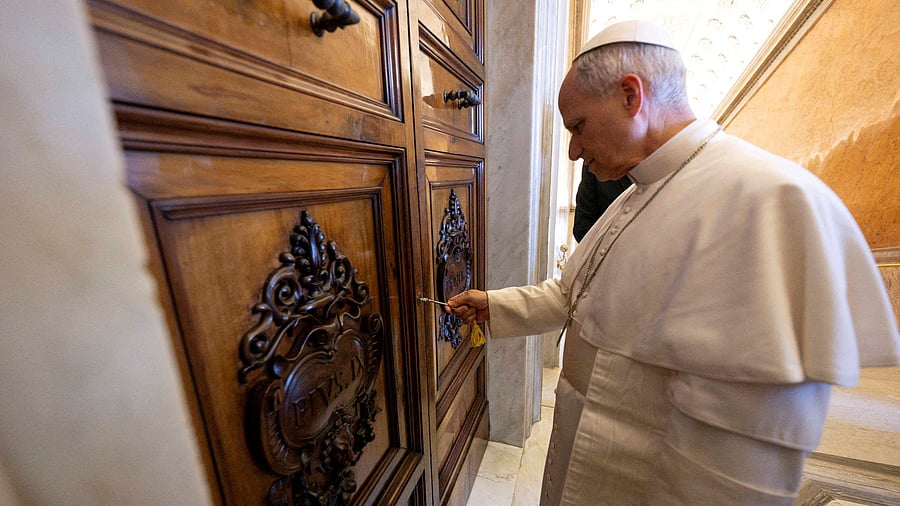 <div class="paragraphs"><p>Pope Leo XIV unlocks the door to the Apostolic Palace.</p></div>