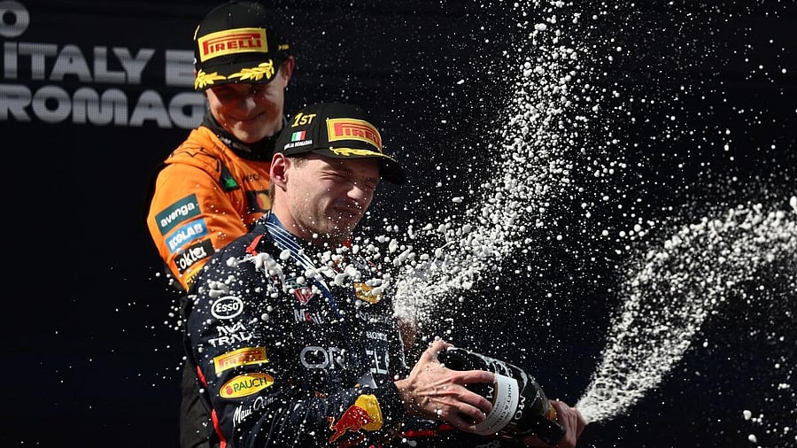 <div class="paragraphs"><p>Red Bull's Max Verstappen celebrates on the podium after winning the Emilia Romagna Grand Prix with third placed McLaren's Oscar Piastri. </p></div>