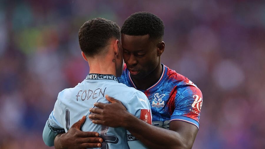 <div class="paragraphs"><p>Manchester City's Phil Foden with Crystal Palace's Marc Guehi after the match.</p></div>
