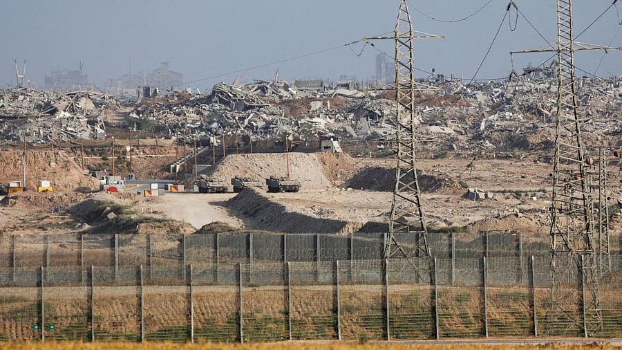 <div class="paragraphs"><p>Military vehicles operate inside Gaza, as seen from the Israeli side of the Israel-Gaza border, May 19, 2025.</p></div>