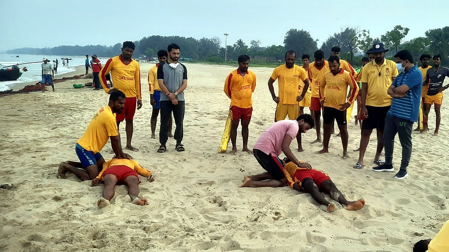 <div class="paragraphs"><p>A training session underway for lifeguards on a beach. </p></div>