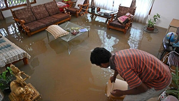 <div class="paragraphs"><p>Rainwater enters homes in BTM Layout, Bengaluru after heavy downpour, on Monday, May 19, 2025. </p></div>