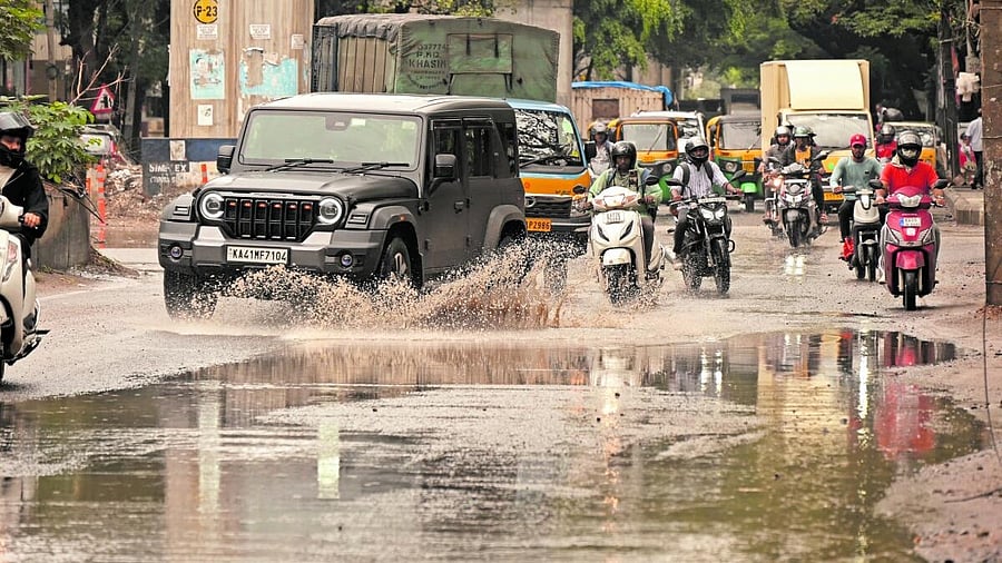 <div class="paragraphs"><p>Vehicles wade through waterlogged on 100 feet road, Koramangala in Bengaluru on Tuesday, 20 May 2025.</p></div>