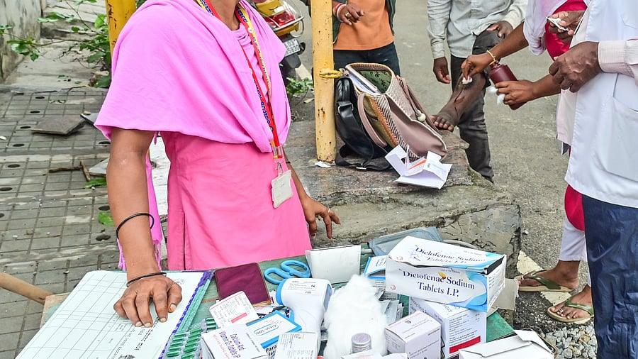 <div class="paragraphs"><p>Medicines were distributed for residents at Sai Layout. In this image, a man is being treated for his wounds. </p></div>