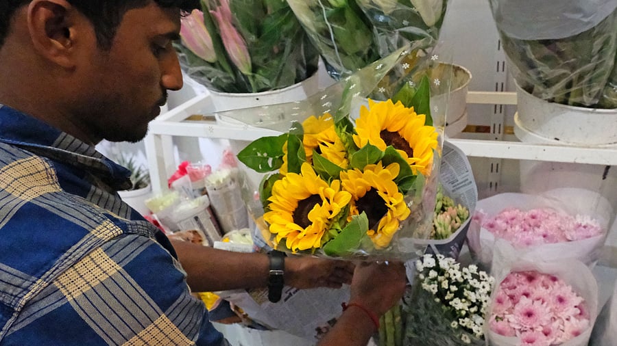 <div class="paragraphs"><p>A florist making a sunflower bouquet at a shop on St Mark’s Road.</p></div>