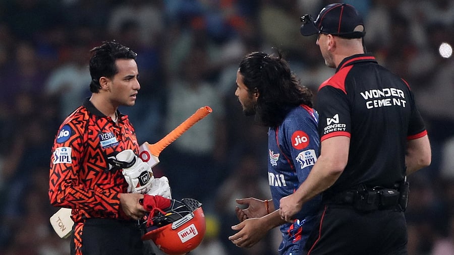 <div class="paragraphs"><p>Lucknow Super Giants' Digvesh Singh reacts with Sunrisers Hyderabad's Abhishek Sharma after taking his wicket as umpire Michael Gough looks on.</p></div>