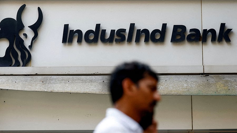<div class="paragraphs"><p>A man walks outside a branch of IndusInd Bank in New Delhi, India.&nbsp;</p></div>