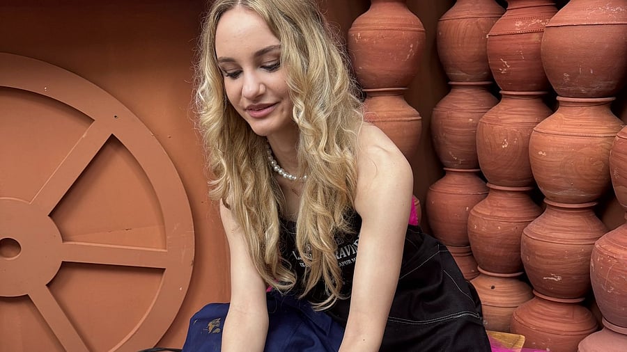 <div class="paragraphs"><p>Miss World contestant engging in pottery making</p></div>