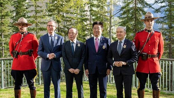 <div class="paragraphs"><p>Bank of Canada Governor Tiff Macklem, Bank of Japan Governor Kazuo Ueda, Japanese Minister of Finance Katsunobu Kato and Canadian Finance Minister Francois-Philippe Champagne with Royal Canadian Mounted Police officers during the G7 finance ministers and central bank governors meeting in Banff, Alberta, Canada,</p></div>