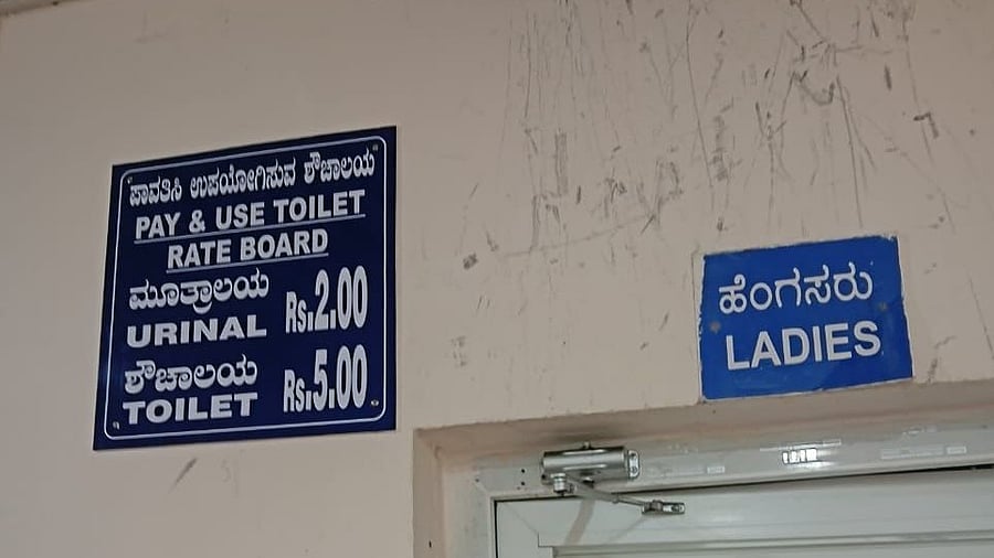A user fee notice put up outside the toilet at a metro station. BMRCL