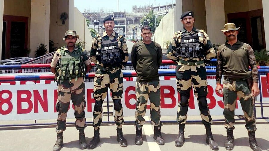 <div class="paragraphs"><p>Purnam Kumar Shaw, centre, with other BSF jawans after he was handed over by Pak Rangers via Attari-Wagah border in Punjab, Wednesday, May 14, 2025.</p></div>