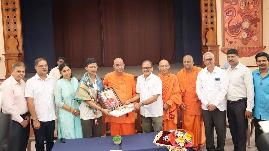 <div class="paragraphs"><p>M N Thanmai (fourth from left), a student of Sri Ramakrishna Vidyashala, who emerged as the state topper with 625 out of 625 marks in SSLC, being felicitated Mysuru on Friday. </p></div>