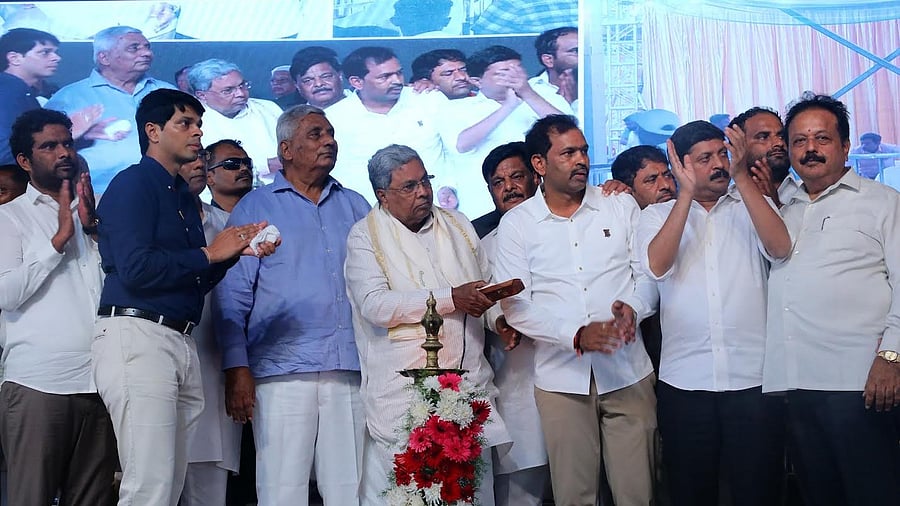 <div class="paragraphs"><p>Chief Minister Siddaramaiah launches various development works in K R Nagar, Mysuru district, on Friday. Ministers H C Mahadevappa, N Chaluvarayaswamy, K Venkatesh are seen. </p></div>