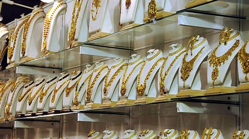 <div class="paragraphs"><p>Gold prices eased by Rs 60 to Rs 27,150 per ten grams at the bullion market in the national capital today owing to slackened demand from jewellers and retailers amid a weak global trend. </p></div>