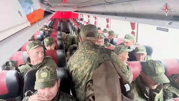 <div class="paragraphs"><p>Russian soldiers pose for cameras in Belarus after release from Ukraine on second day of POW exchange</p></div>