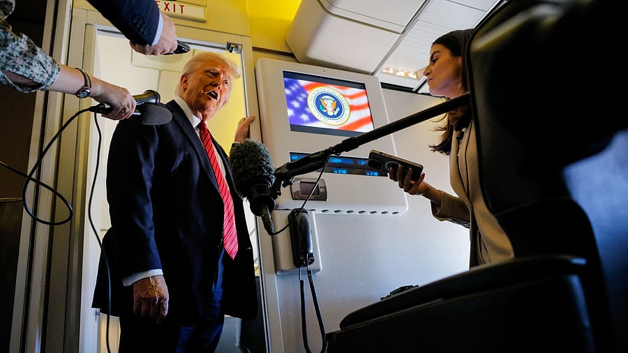 <div class="paragraphs"><p>US President Donald Trump speaks to the press on board Air Force One.</p></div>
