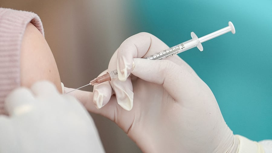 <div class="paragraphs"><p>A woman receives a Covid vaccine.</p></div>