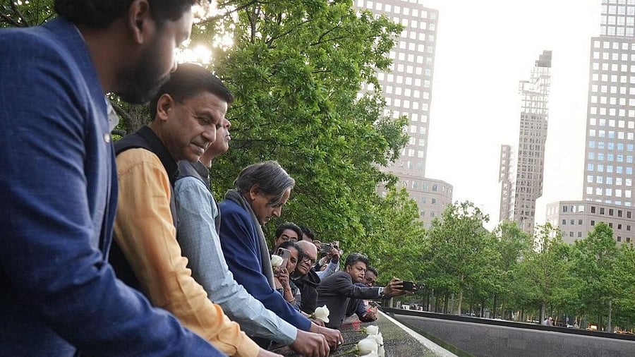 <div class="paragraphs"><p> Congress MP Shashi Tharoor with other members of a multi-party delegation pays tribute at the National September 11 Memorial.</p></div>