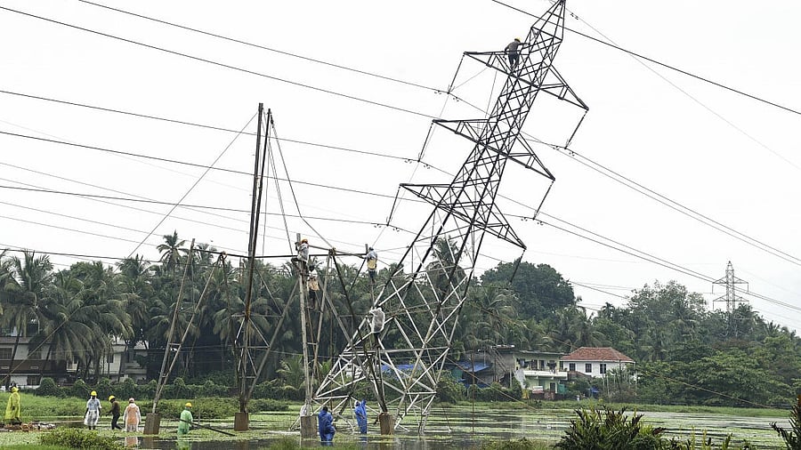 <div class="paragraphs"><p>Restoration work underway after a KSEB high tension tower tilted following heavy rainfall, at Nallalam, in Kozhikode, Kerala</p></div>