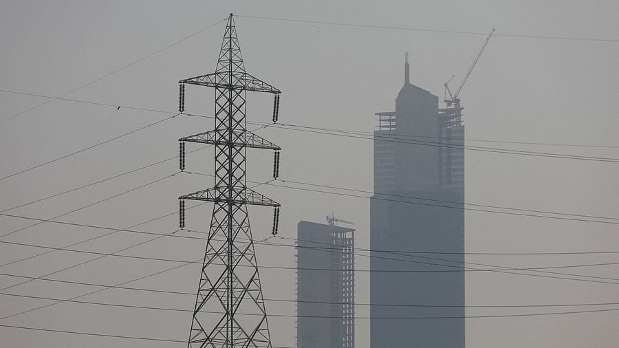 <div class="paragraphs"><p>A power transmission tower is seen, with the Bharia Icon Tower in the background, in Karachi, Pakistan.</p></div>