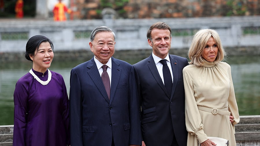 <div class="paragraphs"><p>Vietnam's Communist Party General Secretary To Lam and his wife, Ngo Phong Ly, pose for a picture with French President Emmanuel Macron and his wife, Brigitte Macron, during a luncheon at Van Mieu, in Hanoi, Vietnam May 26, 2025.</p></div>