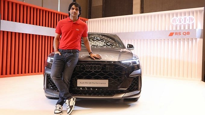 <div class="paragraphs"><p>Neeraj Chopra infront of an Audi.</p></div>
