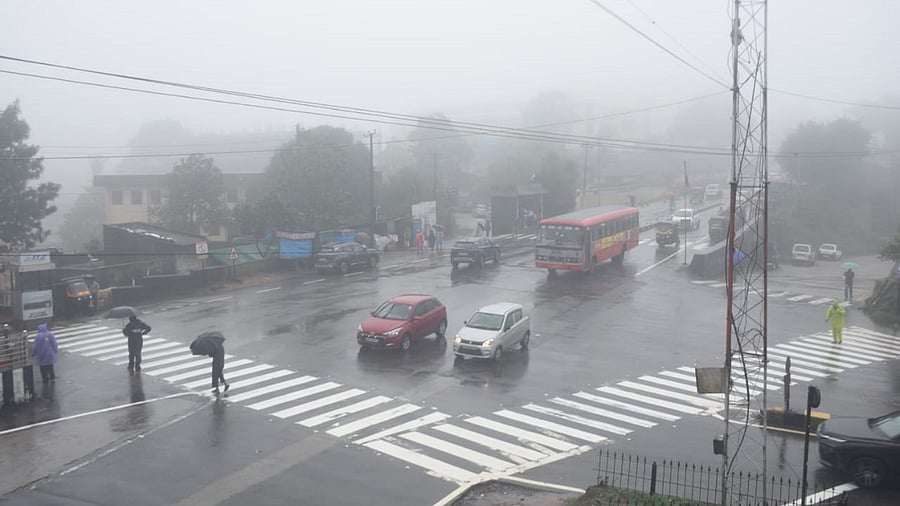 <div class="paragraphs"><p>A thick layer of fog engulfs Madikeri on Tuesday. While rains relented, strong winds uprooted around 200 electricity poles in Kodagu. </p></div>