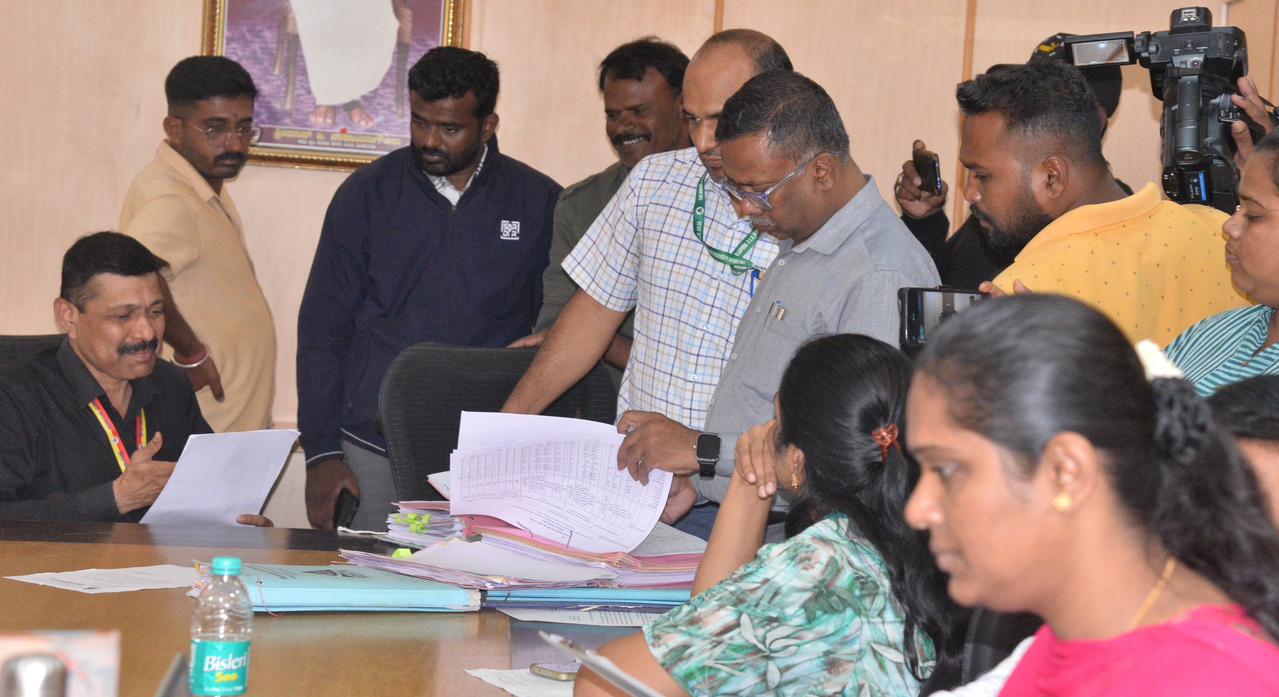 <div class="paragraphs"><p>A team of District Lokayukta led by DySP Sudheendra search for files during a raid on the Kolar DCC Bank on Tuesday. </p></div>