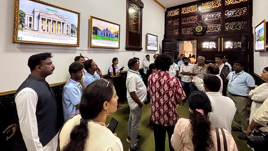 <div class="paragraphs"><p>Visitors were shown the grand rosewood door outside the Legislative Assembly Hall at Vidhana Soudha during a tour on Sunday.&nbsp;</p></div>