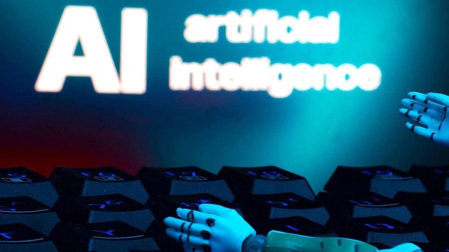FILE PHOTO: A message reading "AI artificial intelligence," a keyboard and robot hands are seen in this illustration created on January 27, 2025. REUTERS/Dado Ruvic/Illustration/File Photo